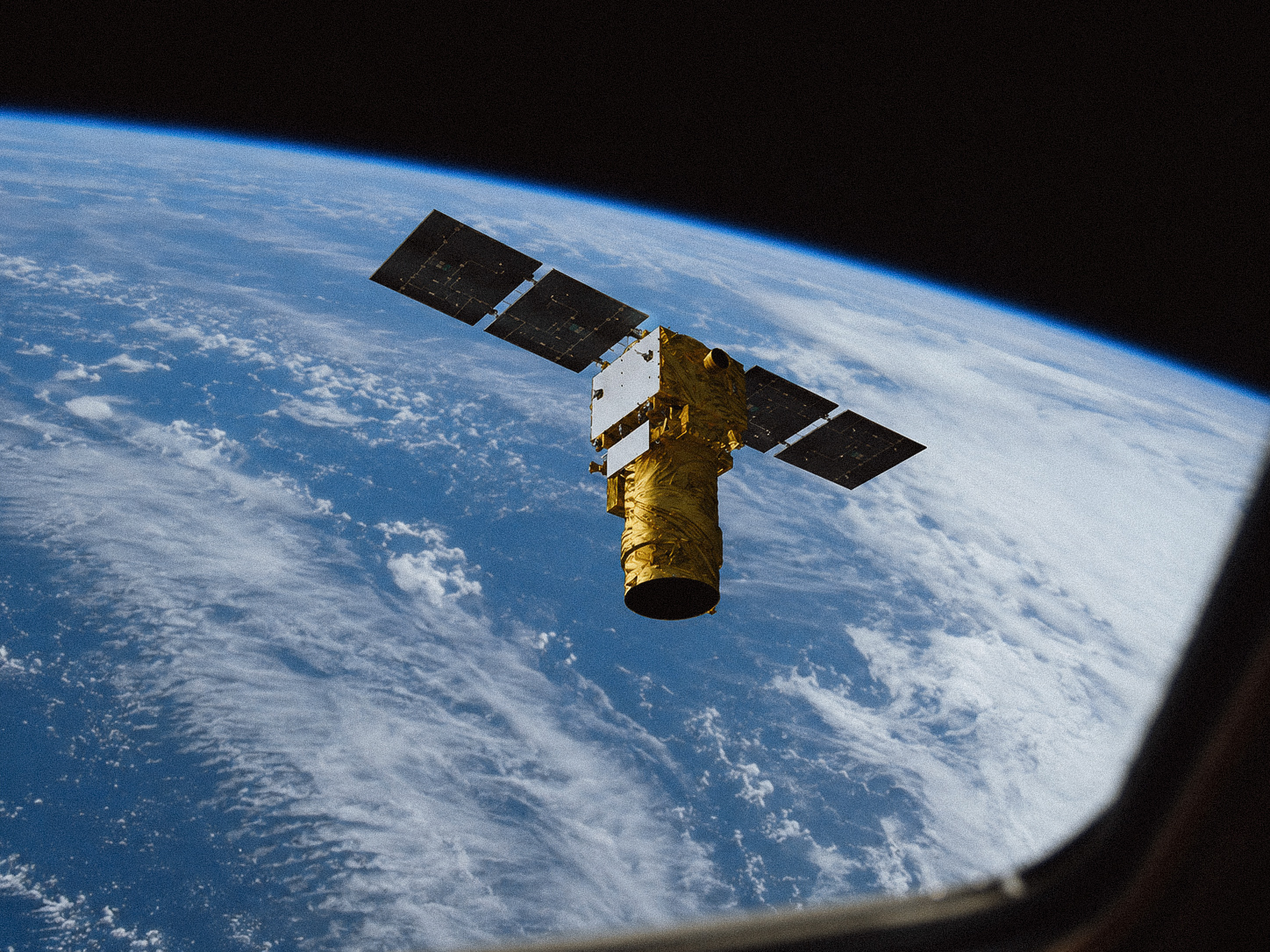 Earth observation satellite above Earth