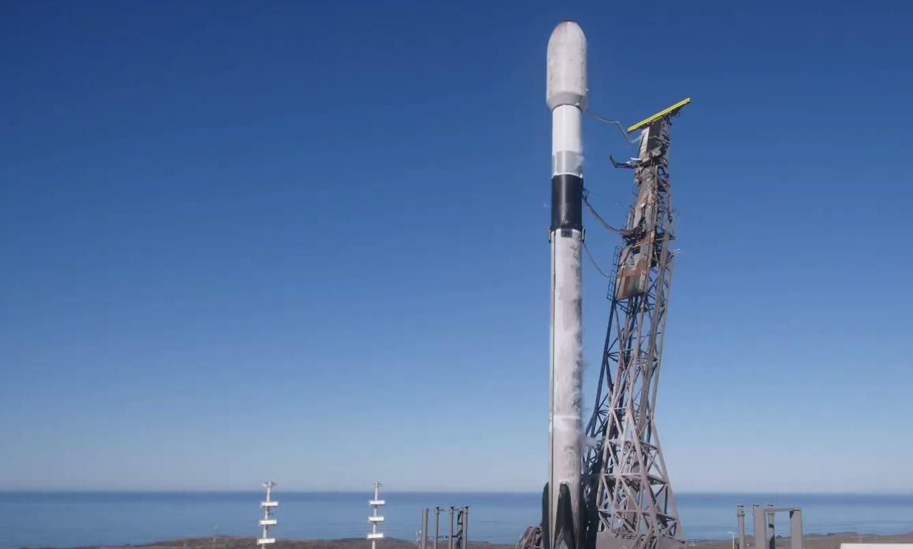 The SpaceX Falcon 9 carrying LOGSATS-2 on the pad at Vandenberg Space Force Base before the Transporter-12 launch